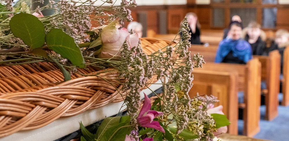 Coffin and flowers at a funeral