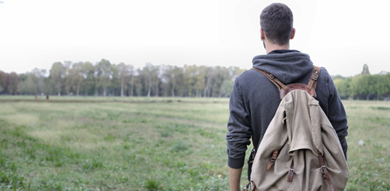 Man standing on green grass field