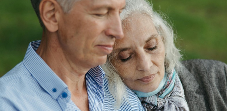 Gray Haired Woman Leaning her Head on the Man's Shoulder