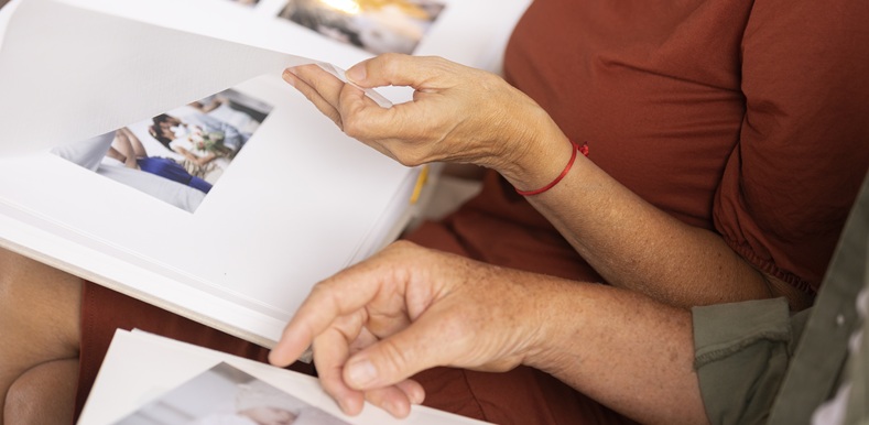 high-angle-people-looking-picture-album